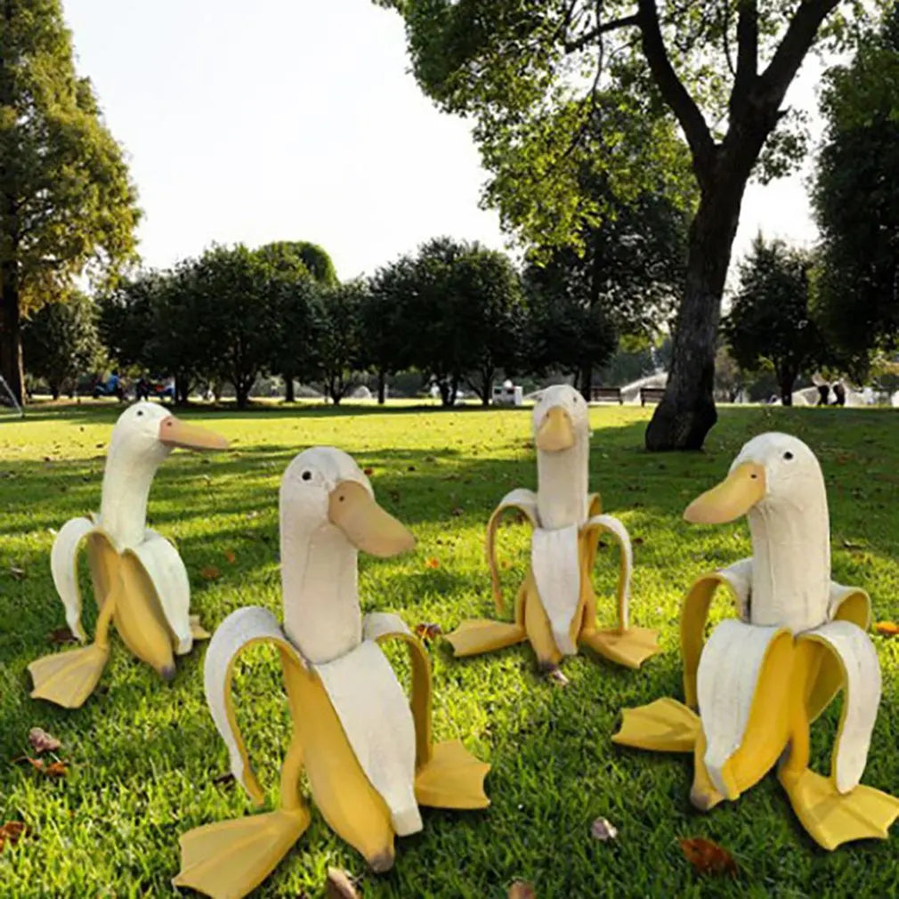 Bananapeck Gartenfigur | Lustige Ente im Bananen-Look | Handbemalt & Wetterfest | Resin