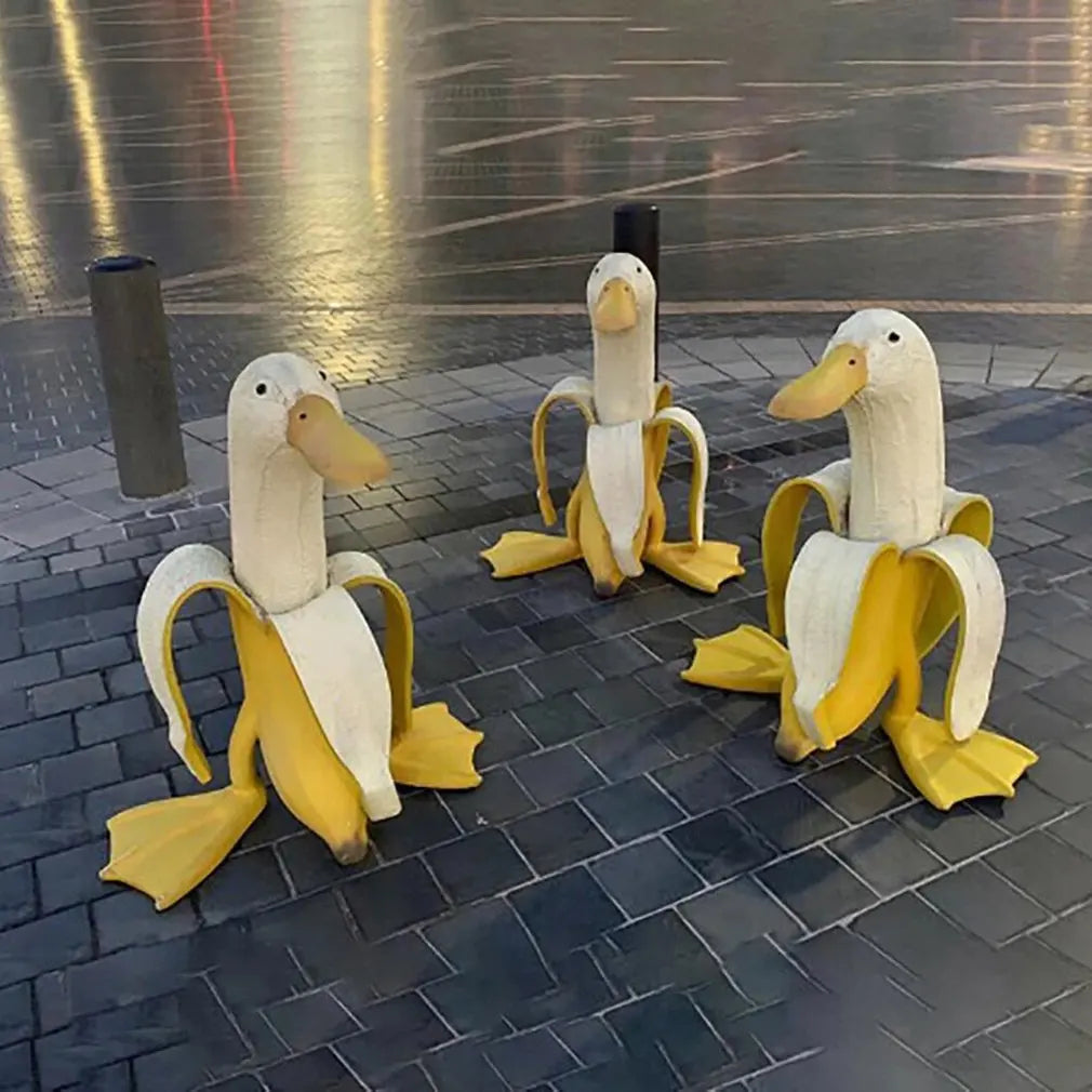 Bananapeck Gartenfigur | Lustige Ente im Bananen-Look | Handbemalt & Wetterfest | Resin
