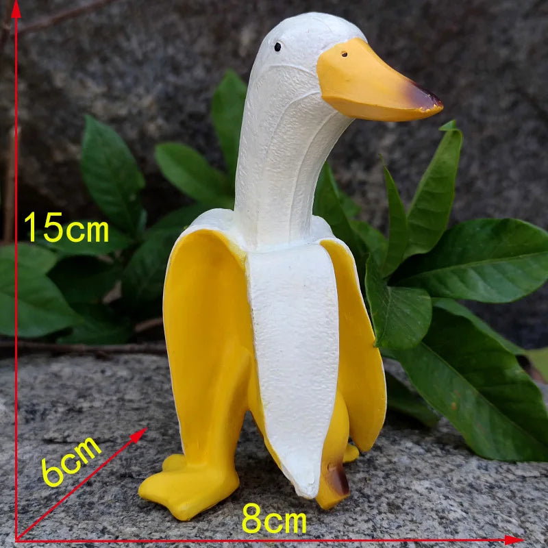 Bananapeck Gartenfigur | Lustige Ente im Bananen-Look | Handbemalt & Wetterfest | Resin