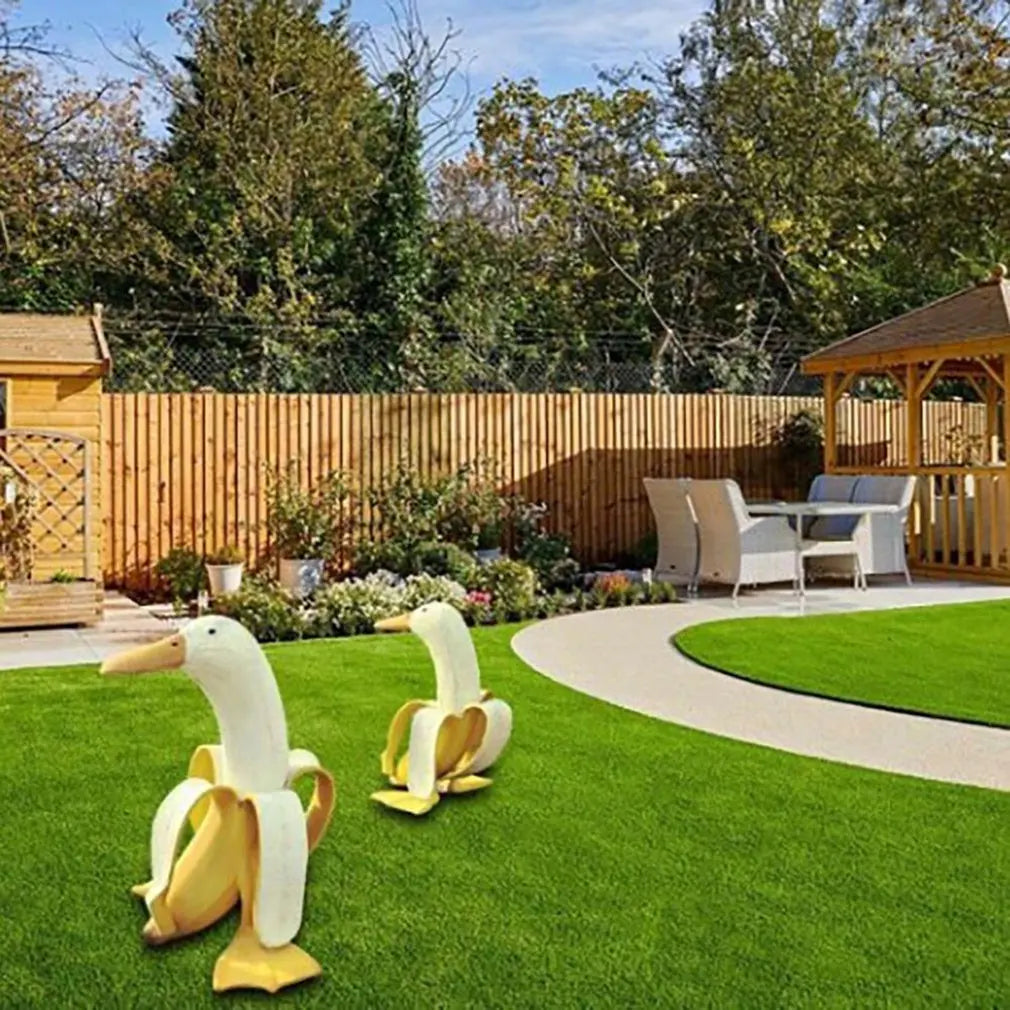 Bananapeck Gartenfigur | Lustige Ente im Bananen-Look | Handbemalt & Wetterfest | Resin