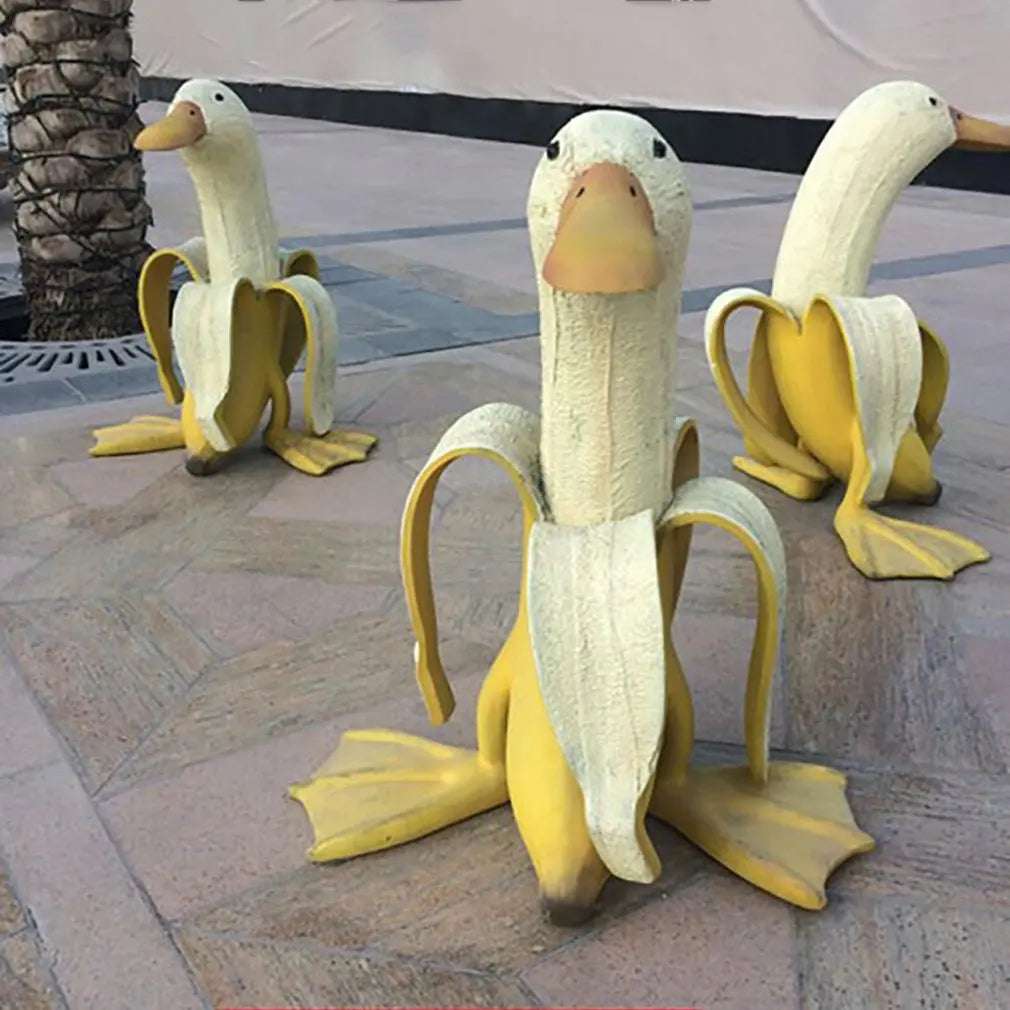 Bananapeck Gartenfigur | Lustige Ente im Bananen-Look | Handbemalt & Wetterfest | Resin